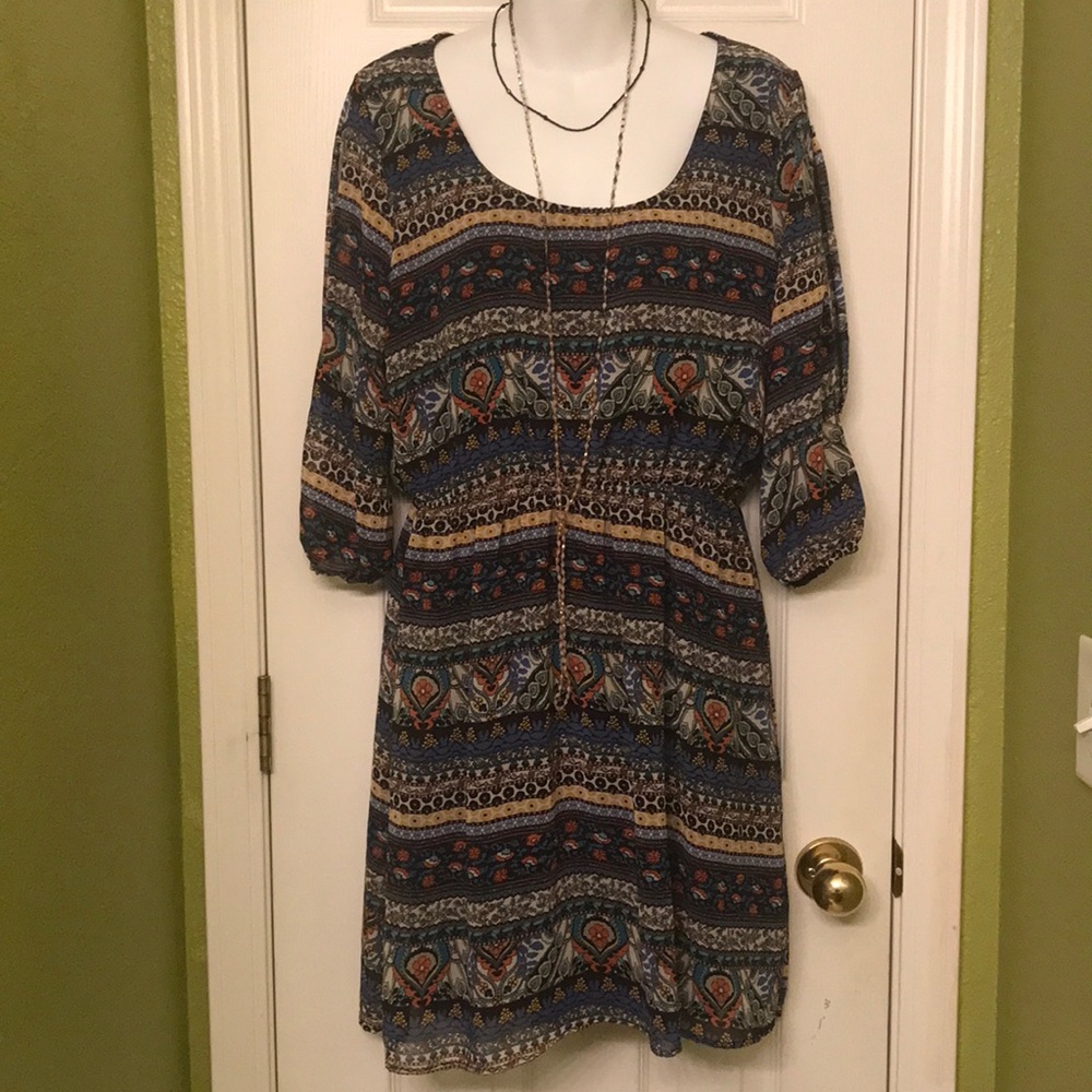 Floral, paisley, and geometric designs on midi length dress, sleeves slit detail